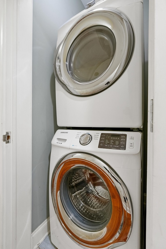 laundry area with stacked washer / drying machine