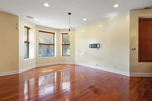 spare room with hardwood / wood-style floors