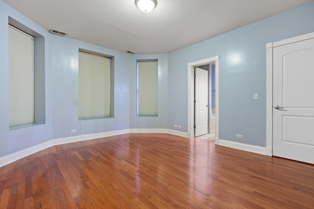 empty room featuring hardwood / wood-style flooring