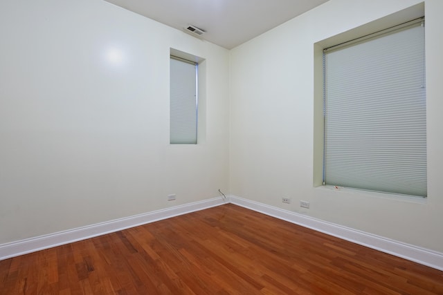 empty room with wood-type flooring