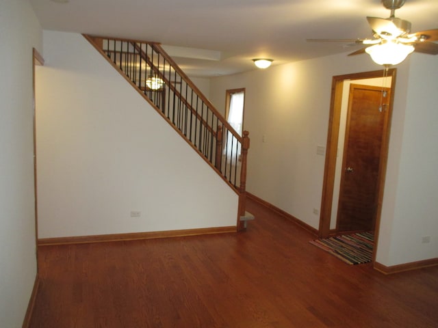 interior space with ceiling fan and wood-type flooring