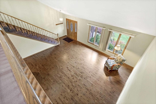 unfurnished living room with wood-type flooring