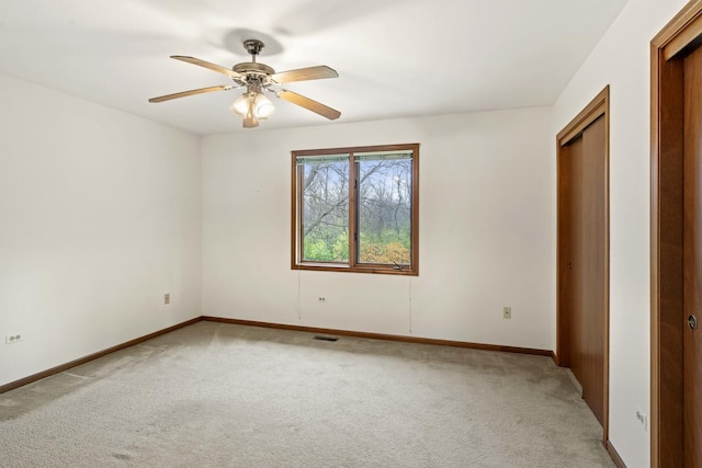 unfurnished bedroom featuring ceiling fan and carpet floors