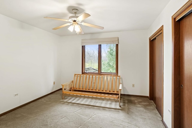 unfurnished bedroom featuring carpet, ceiling fan, and a closet