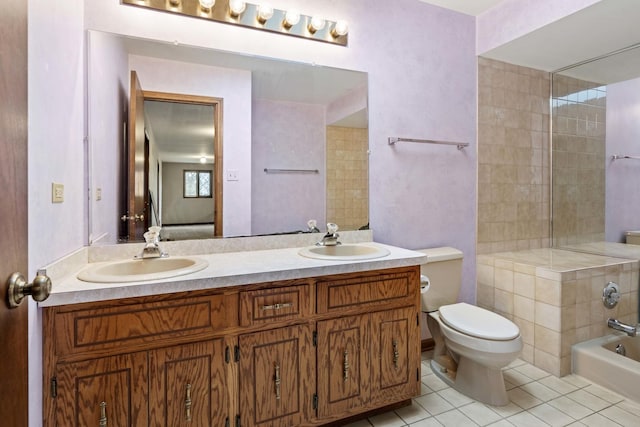 bathroom featuring tile patterned floors, vanity, and toilet