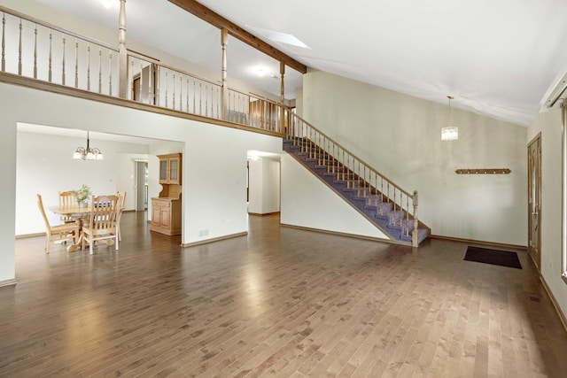 living room featuring hardwood / wood-style floors and high vaulted ceiling