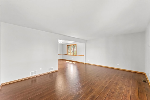 spare room featuring wood-type flooring