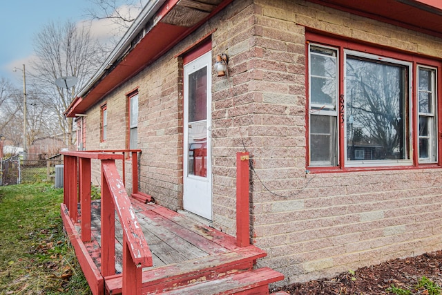 view of side of property with a deck