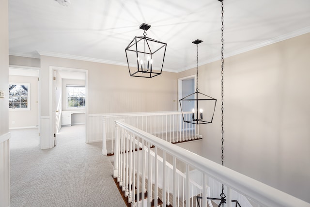 hallway featuring carpet floors and ornamental molding