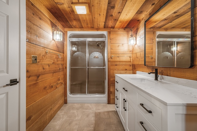 bathroom with vanity, a shower with shower door, wooden walls, and wood ceiling