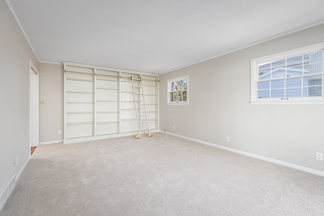 unfurnished bedroom featuring carpet flooring and crown molding