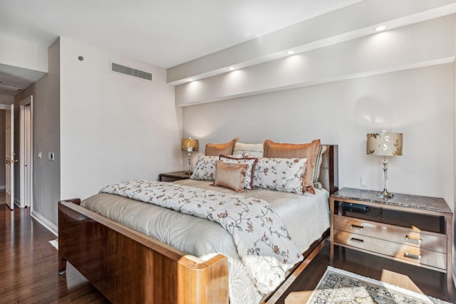 bedroom with dark wood-type flooring