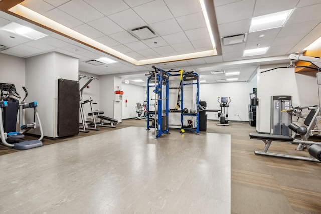 gym featuring a paneled ceiling