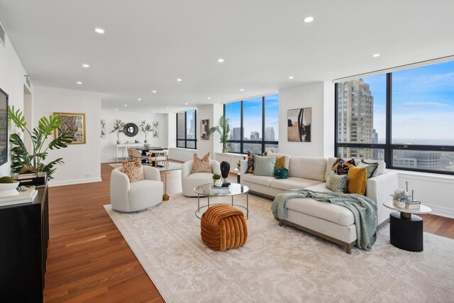 180 E Pearson St Unit 5401, Chicago, IL 60611 - living room featuring recessed lighting, a view of city, wood finished floors, and expansive windows