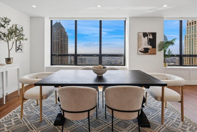 180 E Pearson St Unit 5401, Chicago, IL 60611 - dining space featuring recessed lighting, a view of city, wood finished floors, and expansive windows