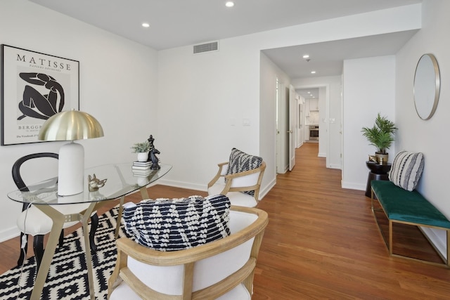 office area with recessed lighting, visible vents, baseboards, and wood finished floors