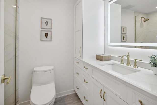 bathroom with visible vents, a marble finish shower, vanity, and toilet