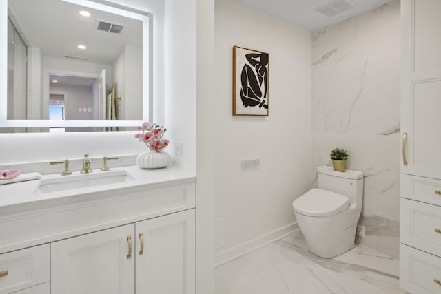 half bathroom featuring toilet, marble finish floor, and visible vents