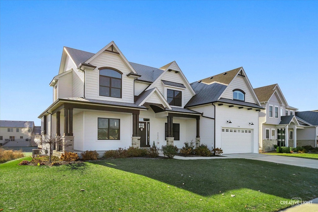 view of front of house featuring a garage and a front yard