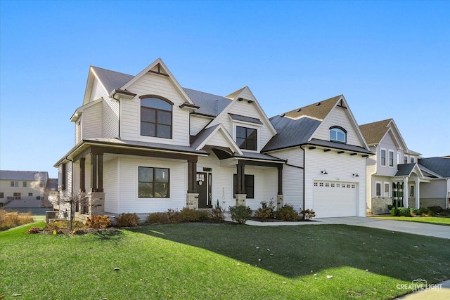 view of front of house featuring a garage and a front yard