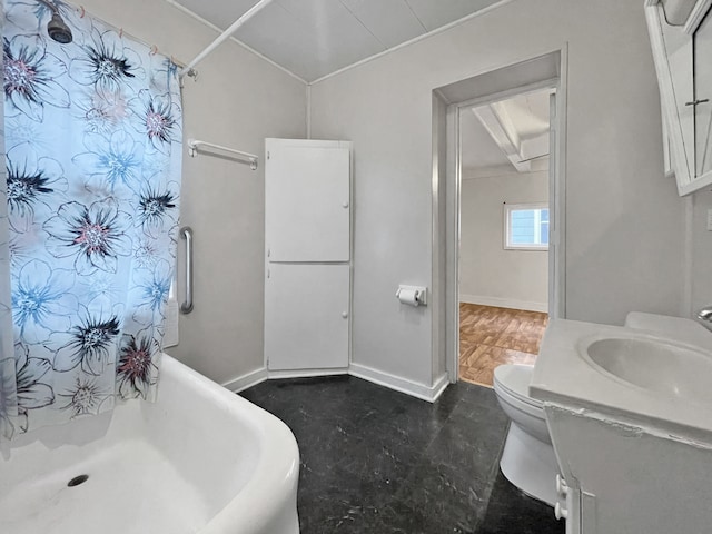 bathroom with walk in shower, vanity, and toilet