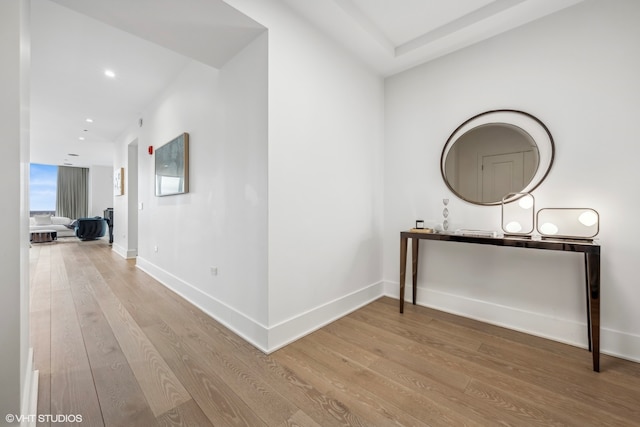 hallway with hardwood / wood-style floors