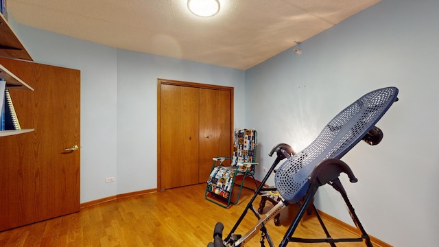 interior space featuring baseboards and wood finished floors