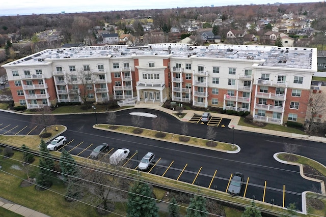 view of property featuring uncovered parking