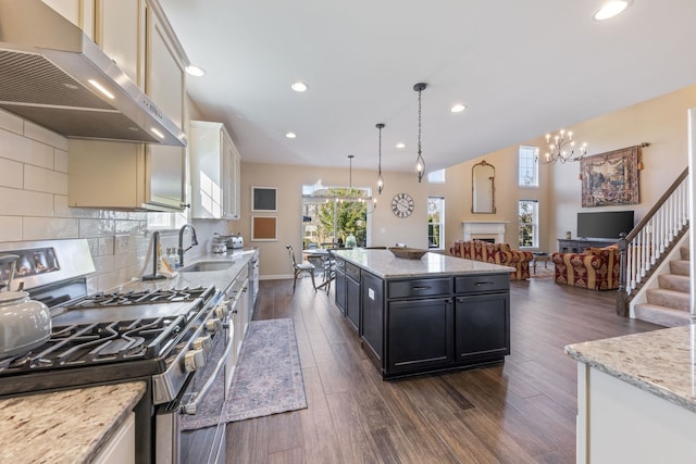 13710 Buchanan Dr, Lemont, IL 60439 - kitchen with range hood, stainless steel gas stove, a chandelier, dark wood-type flooring, and open floor plan