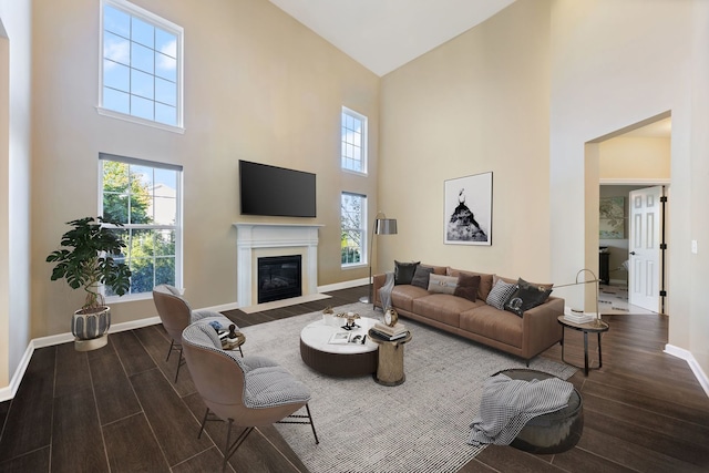 13710 Buchanan Dr, Lemont, IL 60439 - living area featuring wood finished floors, high vaulted ceiling, and a fireplace with flush hearth