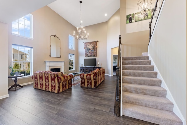 13710 Buchanan Dr, Lemont, IL 60439 - living area with a towering ceiling, stairs, a chandelier, plenty of natural light, and recessed lighting