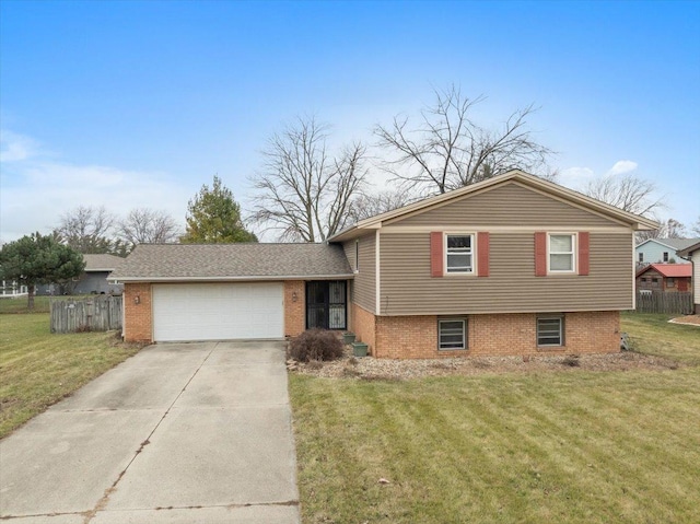 split level home featuring a front lawn and a garage