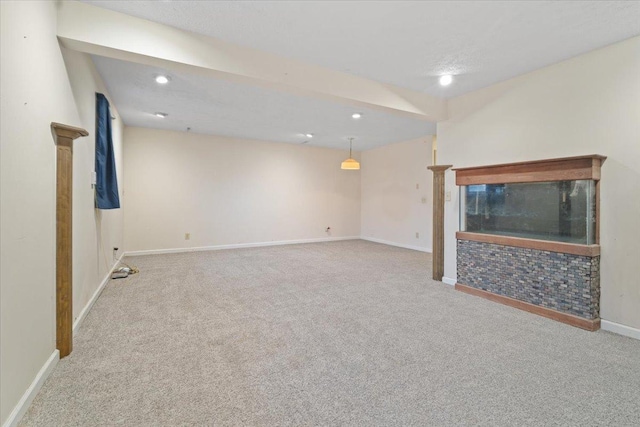 unfurnished living room featuring light carpet