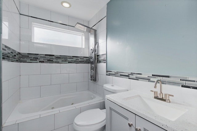 full bathroom with vanity, toilet, and tiled shower / bath