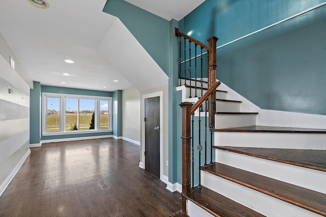 stairway featuring hardwood / wood-style flooring