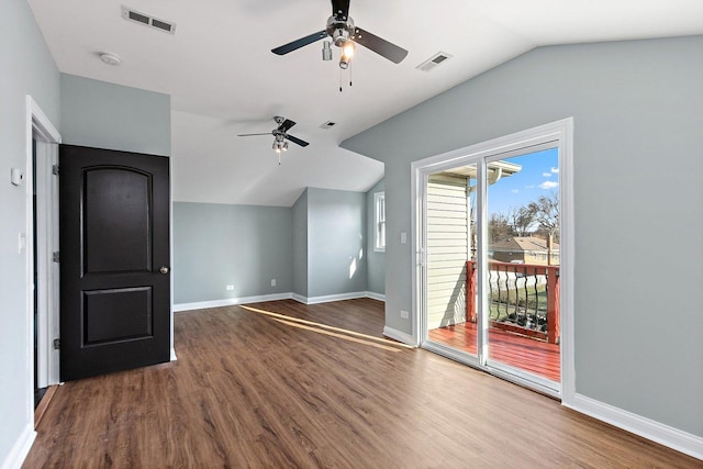 unfurnished living room with ceiling fan, dark hardwood / wood-style flooring, and lofted ceiling