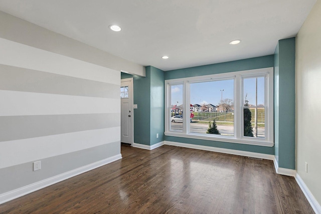 empty room featuring dark wood-type flooring