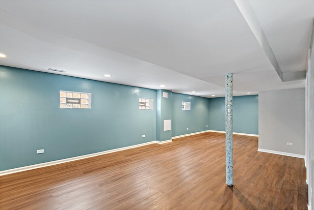 basement featuring hardwood / wood-style flooring