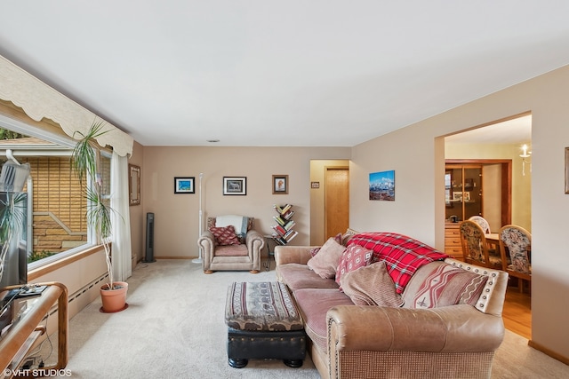 living room featuring plenty of natural light and light colored carpet