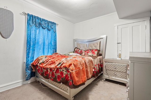 carpeted bedroom featuring ornamental molding