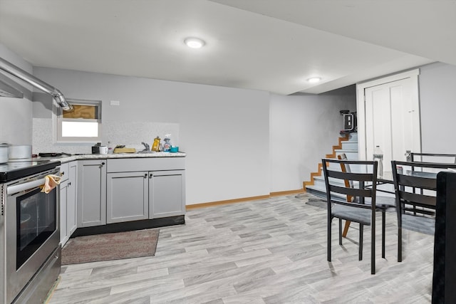 dining room featuring light hardwood / wood-style floors and sink