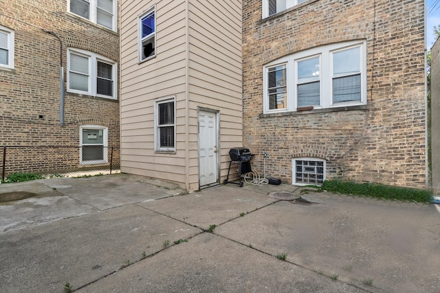 entrance to property featuring a patio area