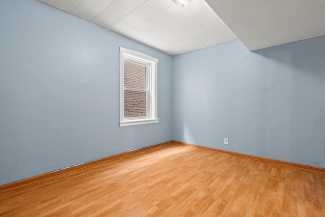 unfurnished room with light hardwood / wood-style floors