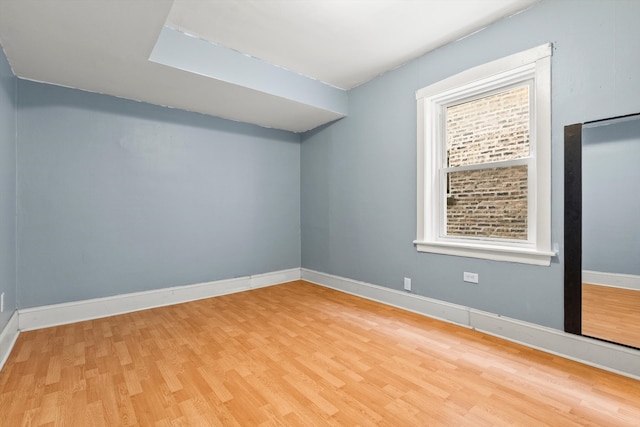 empty room featuring hardwood / wood-style flooring