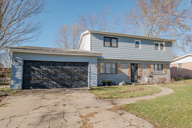 front of property featuring a front yard and a garage