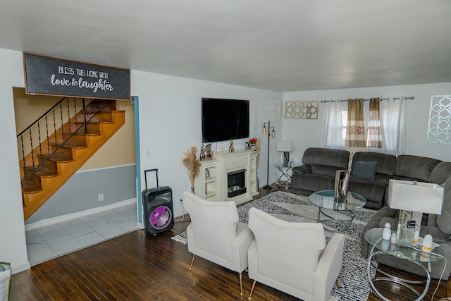 living room with dark hardwood / wood-style flooring