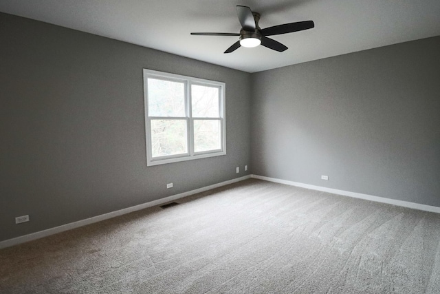 unfurnished room with carpet and ceiling fan