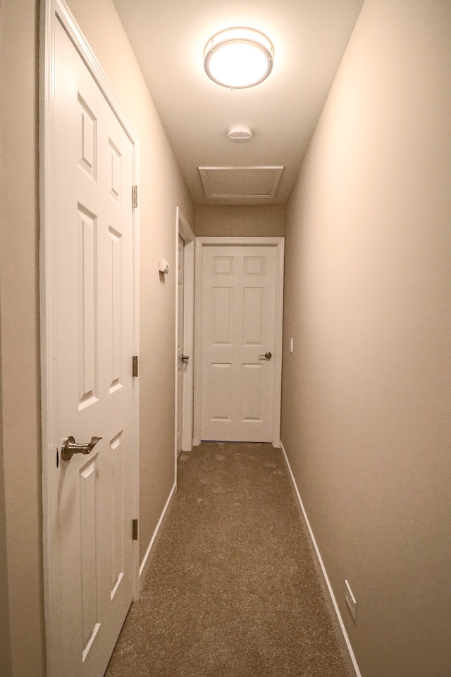 hallway with dark carpet