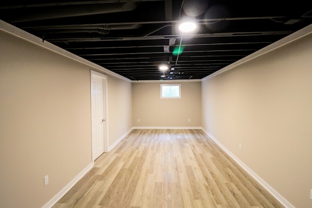 basement featuring light hardwood / wood-style floors