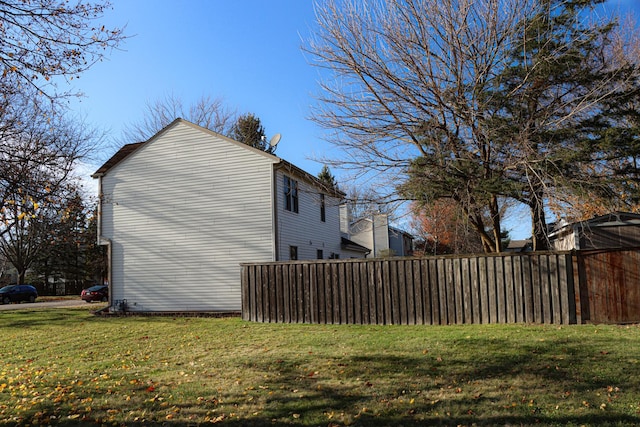 view of property exterior with a lawn